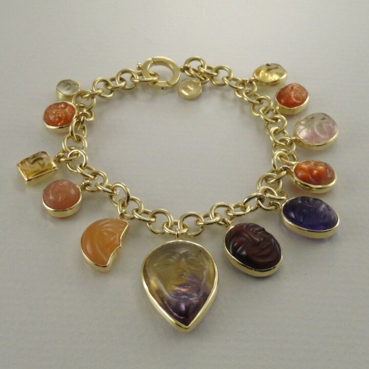 Carved Faces Charm Bracelet